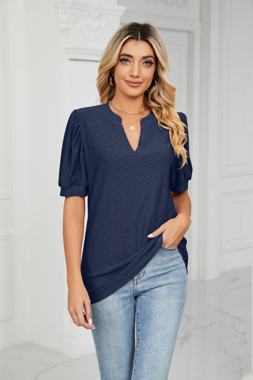 Dark Navy perforated puff sleeve blouse with keyhole neckline and textured pattern.