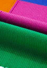 Patchwork knit crewneck pullover sweater in orange, pink, green, and blue acrylic blocks.