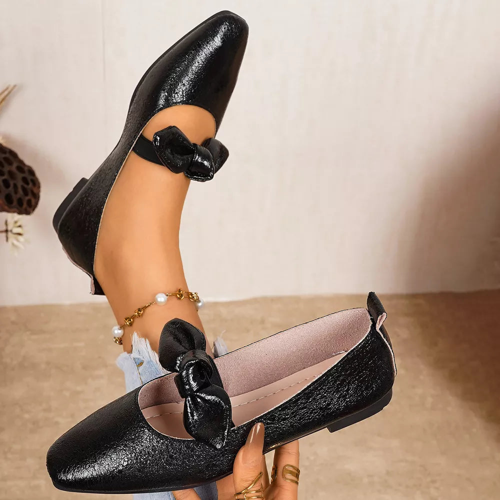 Black square toe slip-on flats with bow detail on strap and vamp