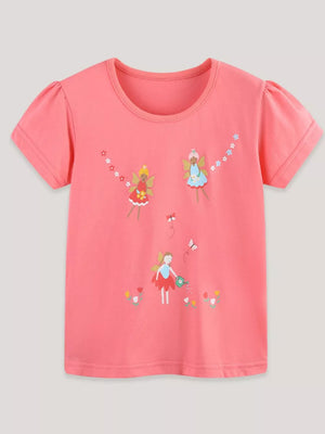 Coral t-shirt with puff sleeves and an enchanted fairy garden print featuring butterflies and flowers.