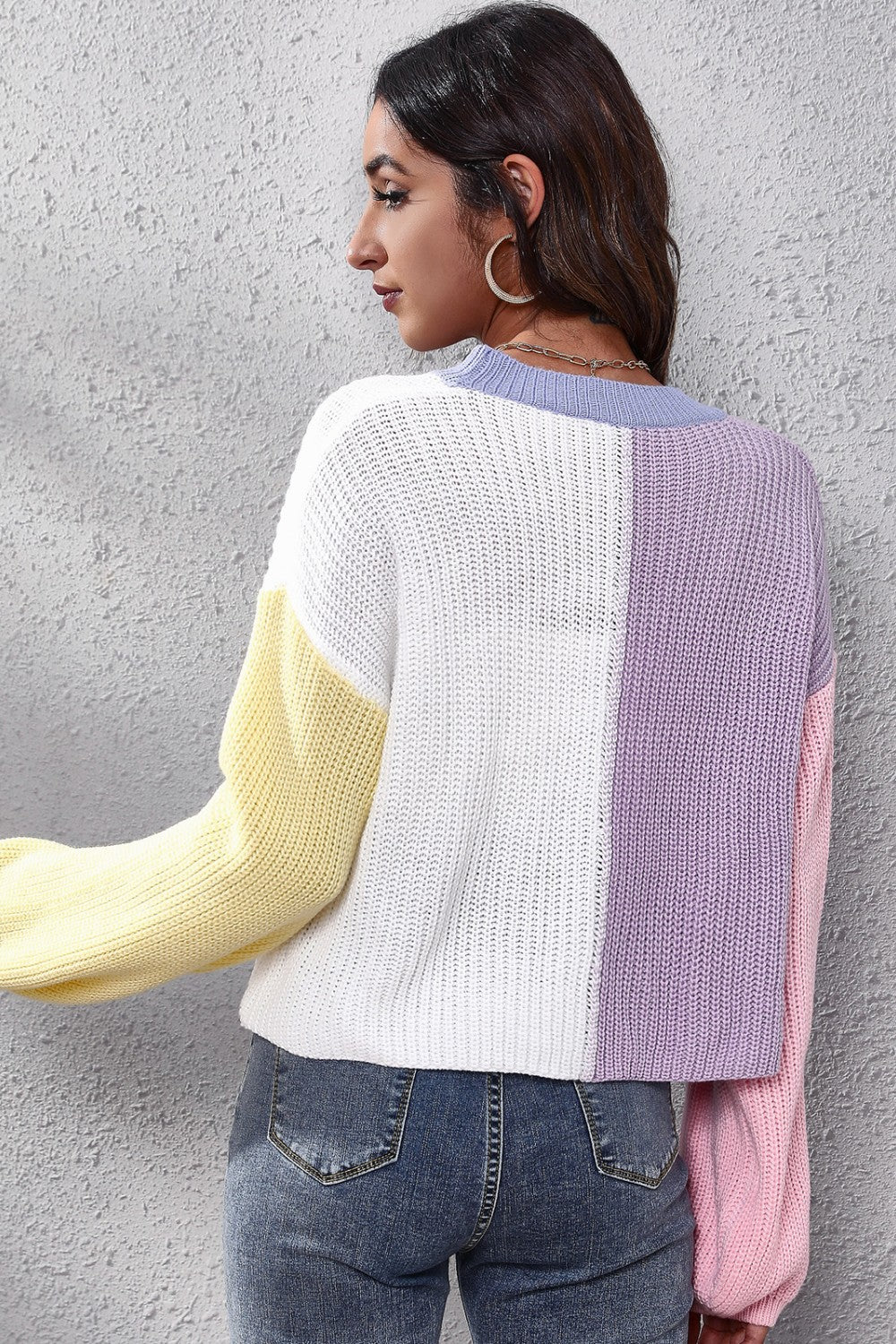 Colorblock knit cardigan with balloon sleeves in white, yellow, purple, and pink acrylic.