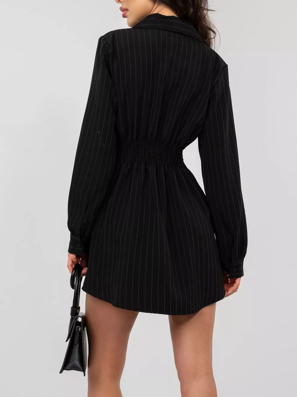 Black pinstripe mini dress with cinched waist and button detail