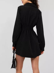 Black pinstripe mini dress with cinched waist and button detail