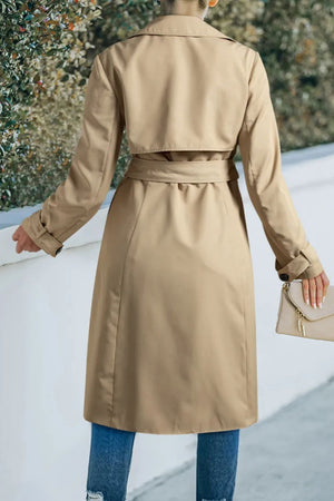 Classic trench coat in Dust Storm with a bow-tie waist and buttoned cuffs.