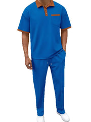 Blue textured polo shirt with contrast collar and pocket, and matching track pants.