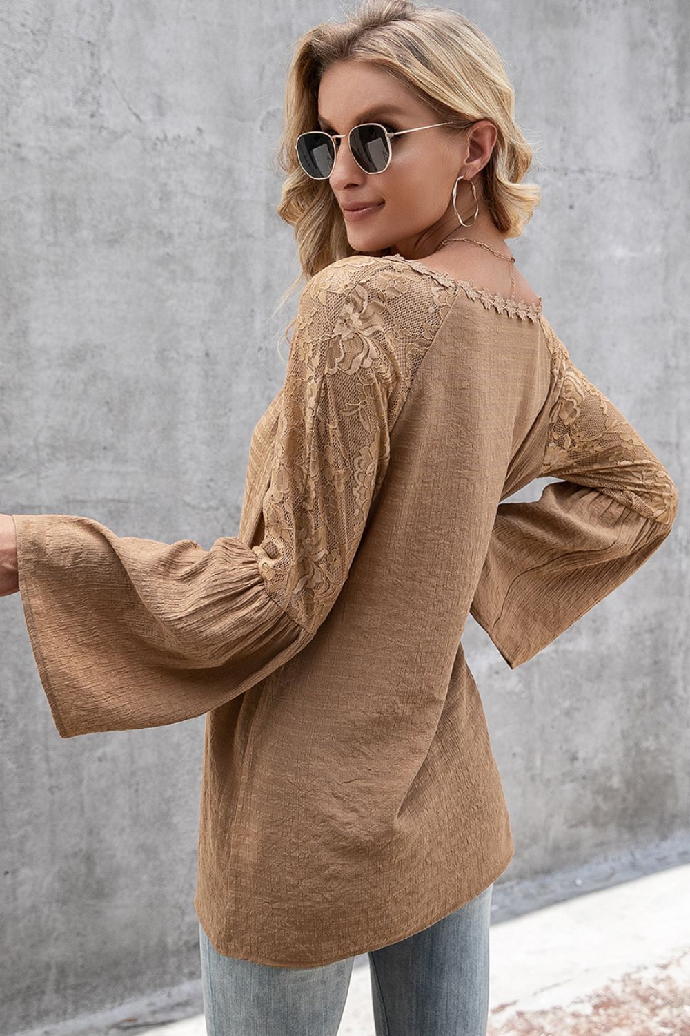 Camel blouse with lace sleeves and scallop trim neckline.