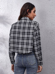 Checkerboard cropped shirt jacket in plaid with button details, styled with jeans.