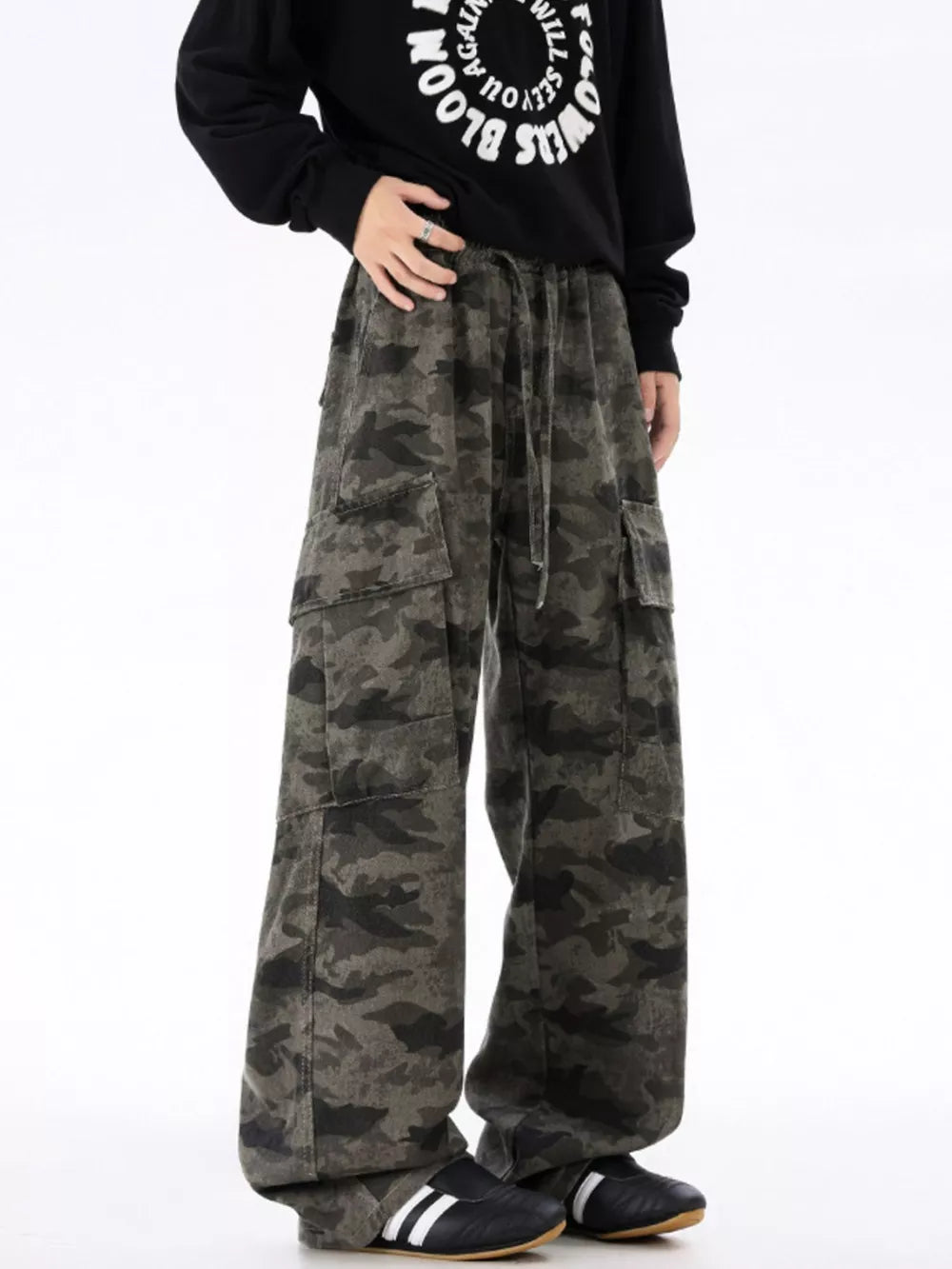 Urban camouflage cargo sweatpants with drawstring waist and multiple pockets.