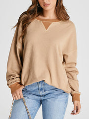 Tan waffle knit raglan sleeve sweatshirt with contrast neckline and cuffs.