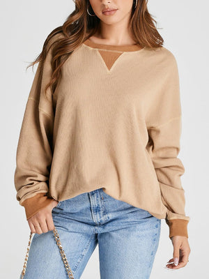 Tan waffle knit raglan sleeve sweatshirt with contrast neckline and cuffs.