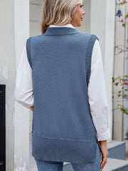 Dusty blue ribbed knit vest with side buttons, collar, and ribbed hem.