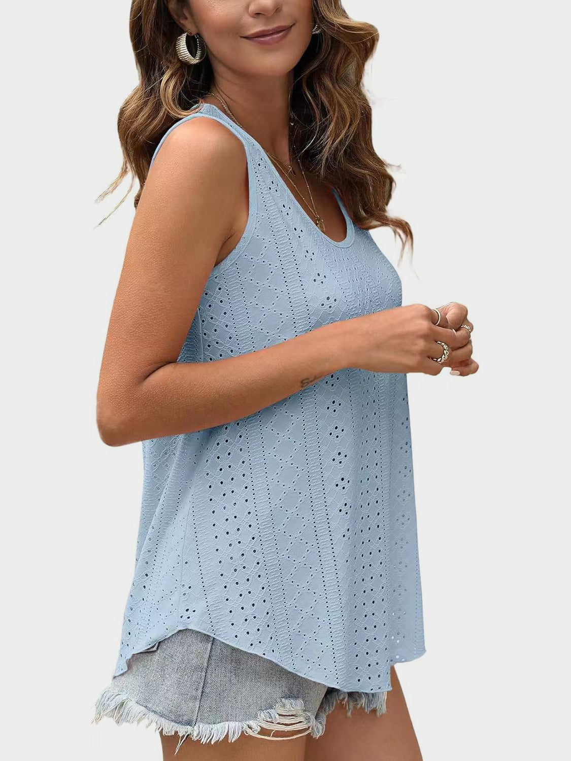Light blue eyelet scoop-neck trapeze tank top with breathable fabric.