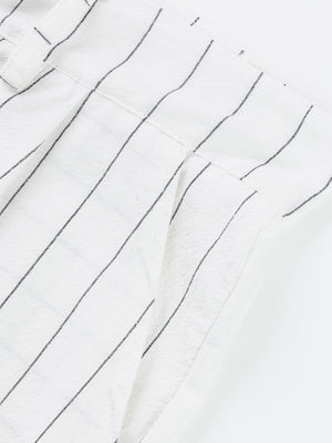 White striped men's sweatpants with a wide-leg cut and textured fabric detail.