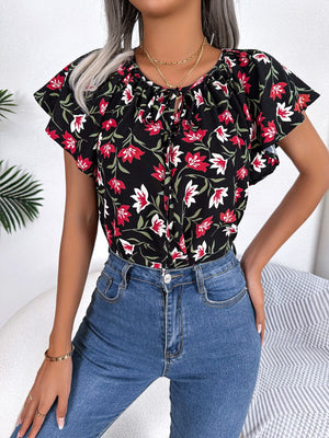 Black floral ruffle sleeve tie-neck blouse with red and white flowers
