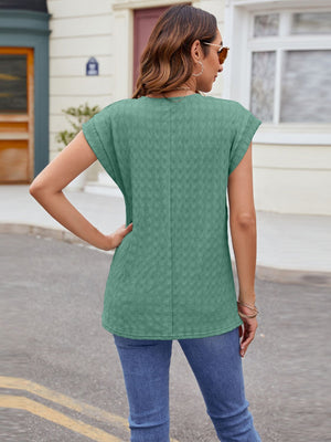 Green cap-sleeve tee with subtle knit texture and a relaxed fit.