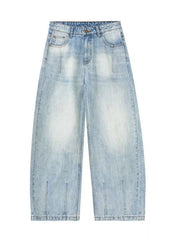 Men's light blue wide-leg stretch jeans with a faded wash and split hem detail.