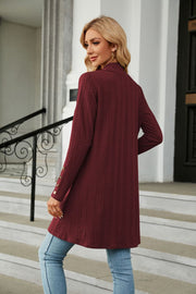 Burgundy textured knit duster cardigan with button detail on sleeve cuff
