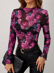 Floral mesh second-skin top with lettuce trim neckline and cuffs.