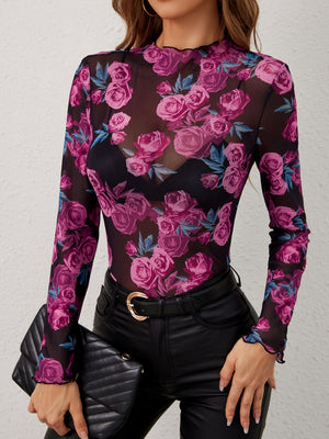 Floral mesh second-skin top with lettuce trim neckline and cuffs.