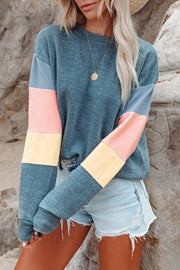 Colorblock sweatshirt with crewneck and long sleeves in gray, pink, and yellow accents.