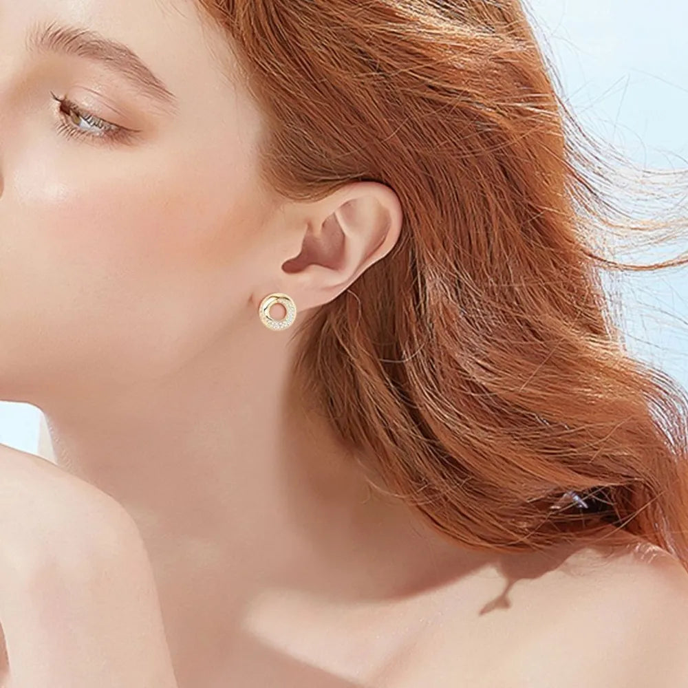 Gold pavé circle stud earrings with delicate detailing.