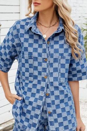 Boxy denim shirt in medium blue checkered pattern with button front and short sleeves.