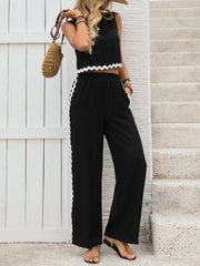 Black scalloped trim crop top and wide leg pants set with white scalloped trim detail.
