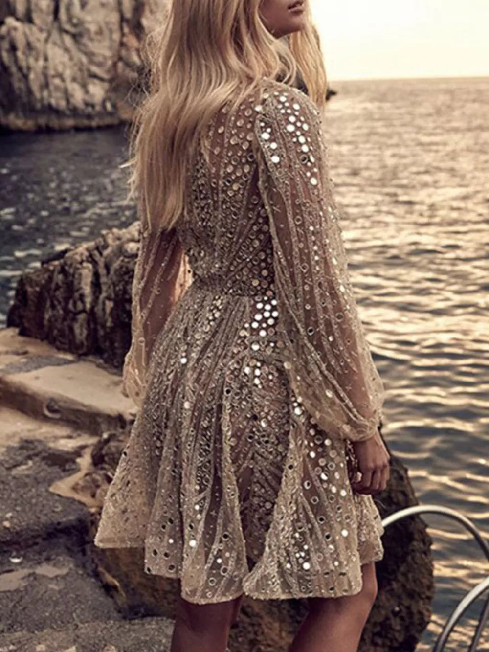 Gold sequin mini dress with balloon sleeves and a-line skirt.