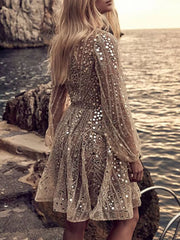 Gold sequin mini dress with balloon sleeves and a-line skirt.