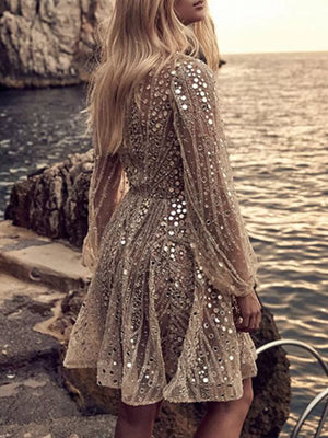 Gold sequin mini dress with balloon sleeves and a-line skirt.