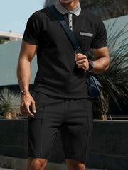 Black polo shirt and shorts set with grey collar and pocket detail