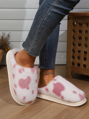 Blush pink cow print faux fur house slides with white soles