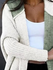 Two-tone hooded knit cardigan in Matcha Green and cream with ribbed sleeves.