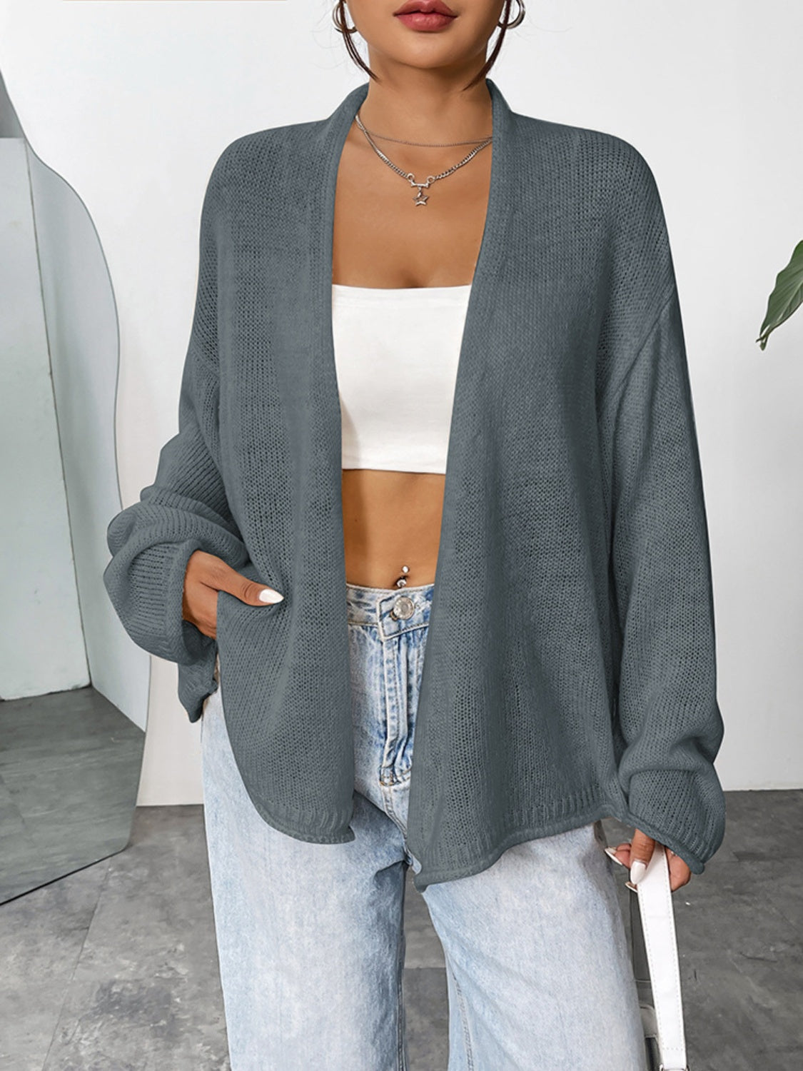 Dark gray acrylic open-front slouchy knit cardigan with pockets.