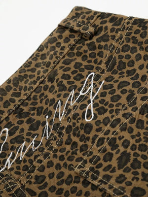 Men's capris with leopard print and white embroidered text detail.