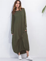 Matcha green long sleeve maxi dress with balloon hem and pockets, styled with sneakers.