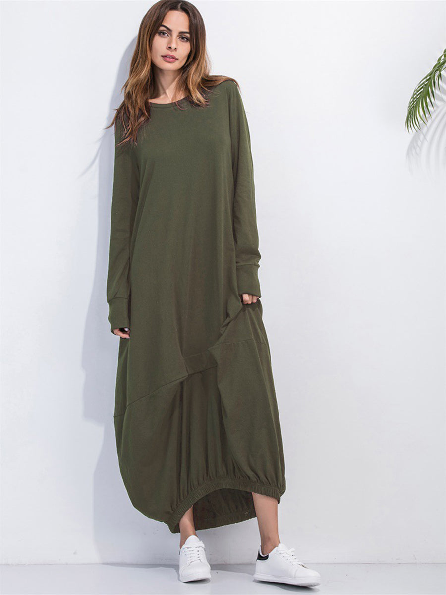 Matcha green long sleeve maxi dress with balloon hem and pockets, styled with sneakers.