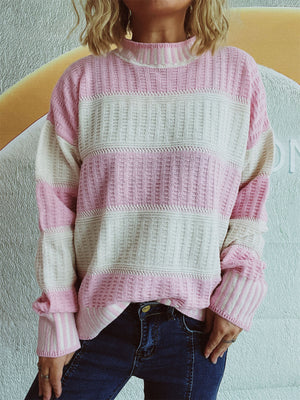Textured stripe mock neck knit sweater in blush pink and cream with a relaxed fit.