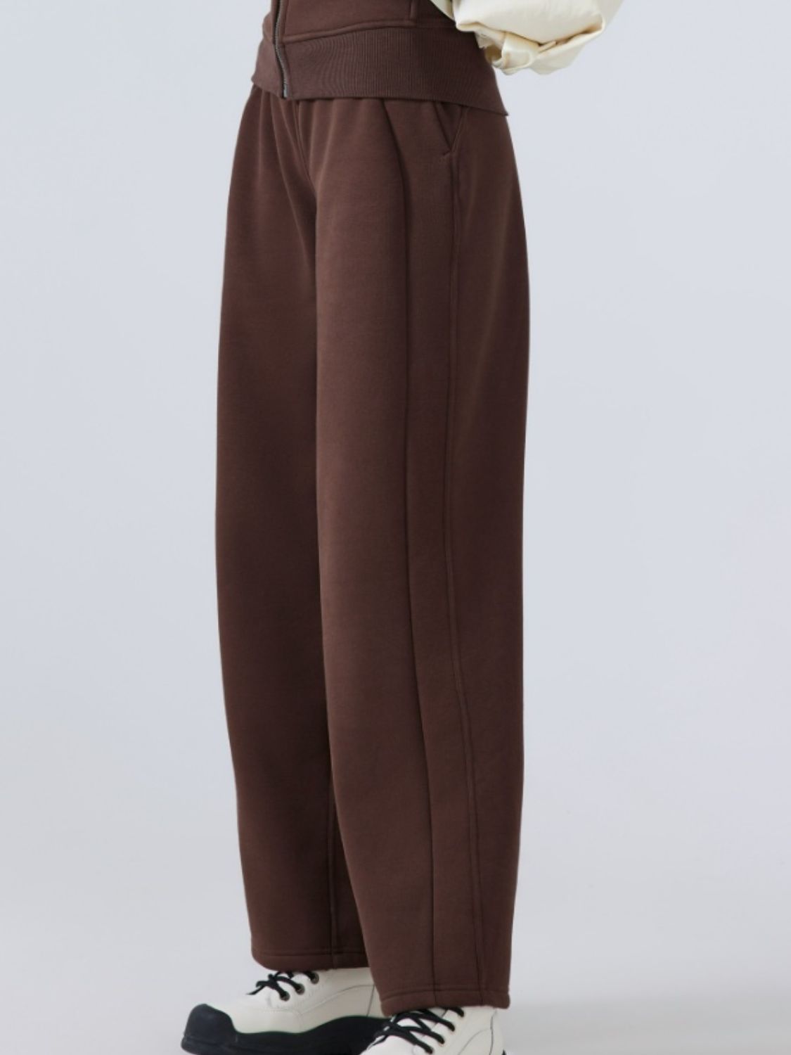 Relaxed palazzo sweatpants in chocolate brown with drawstring waist and pockets.