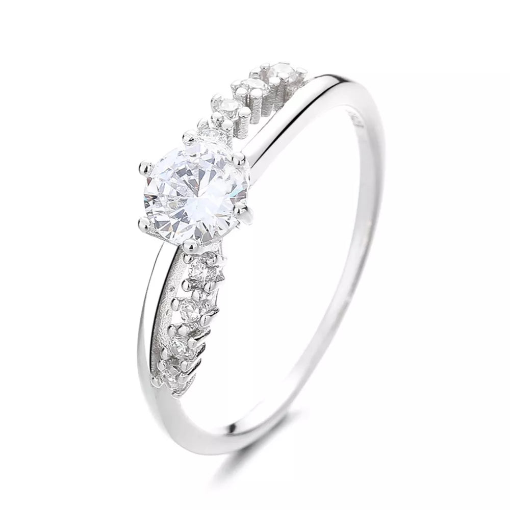 Sterling silver ring with round cubic zirconia and pave accents.
