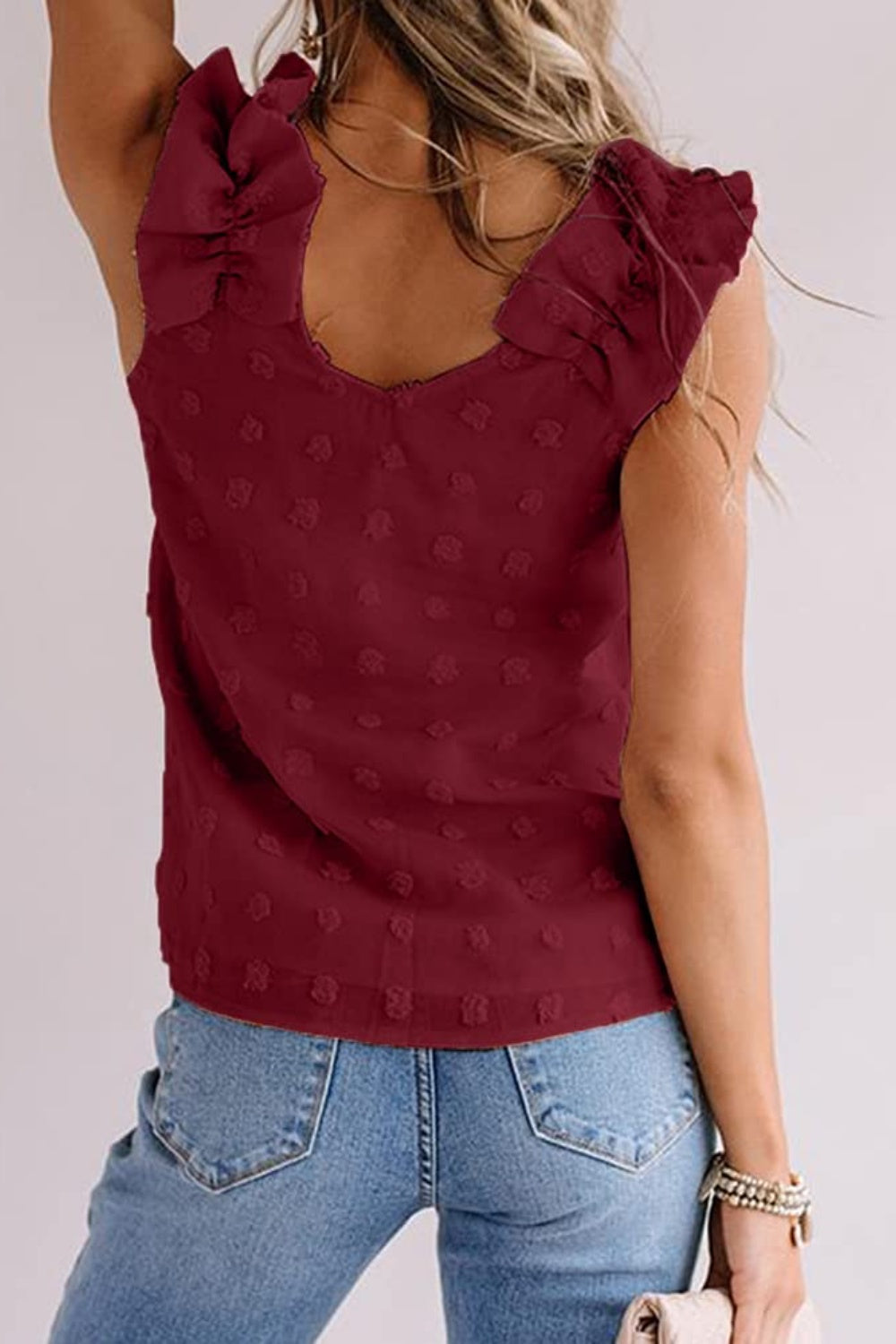 Burgundy textured ruffle-sleeve tank top with a V-neckline.
