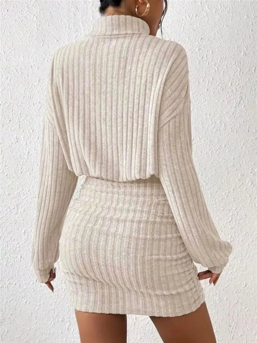 Cozy ribbed turtleneck mini dress in Dust Storm with long sleeves and a ruched skirt.
