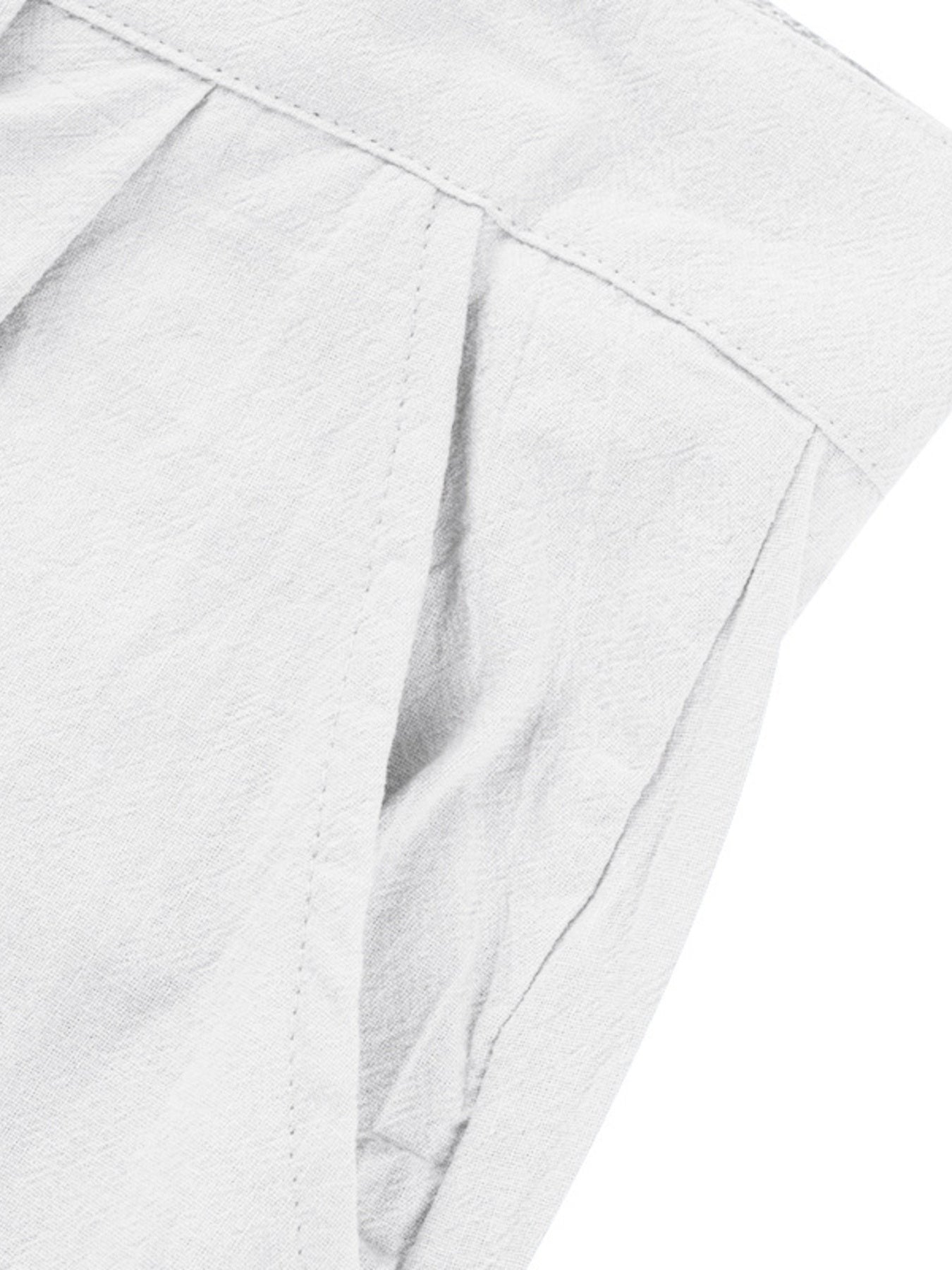 White relaxed fit sweatpants with pleats and pocket detail