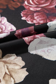 Black mesh blouse with a romantic floral print and a second-skin fit.