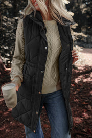 Black diamond quilted longline vest with cinched waist detail and snap front.