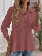 Textured tiered button-down shirt in dusty pink with crinkled fabric and button details.