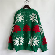 Green acrylic sweater with red Christmas trees and white snowflakes appliqué.