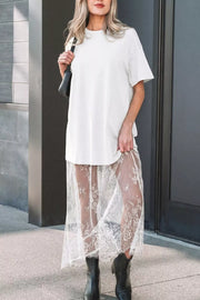 White cotton t-shirt midi dress with sheer lace overlay skirt and short sleeves.
