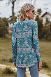 Turquoise paisley print long sleeve blouse with gathered detail.