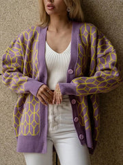 Geometric knit button-up cardigan in dusty pink with yellow pattern.